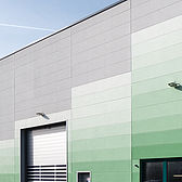 Hallenbau für Muehlhause von Schreiber Stahlbau mit farbig beschichteter Fassade aus Porenbeton